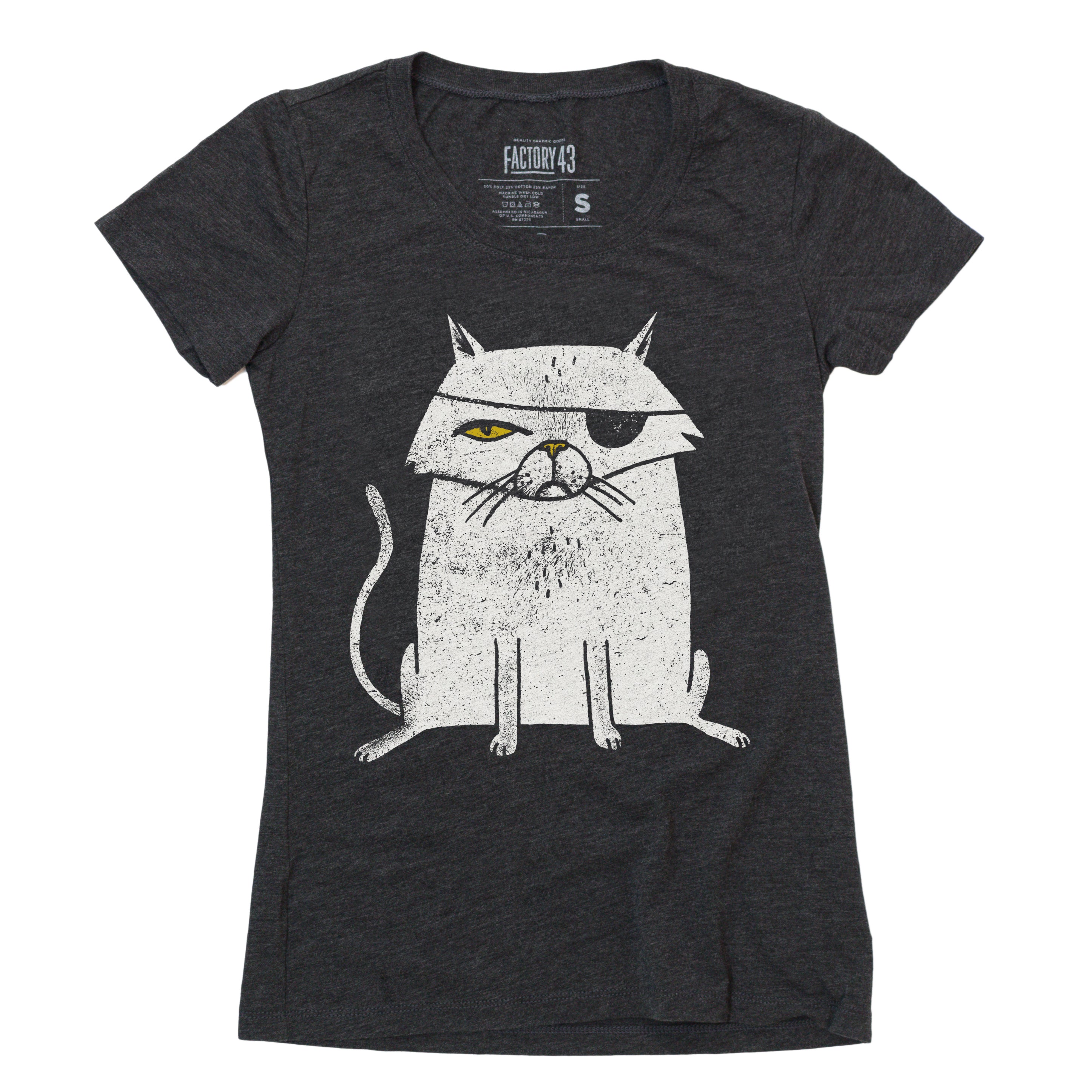 Slim style of super soft gray black womens tshirt of a one eyed cat with an eyepatch. The cat looks like a pirate or an evil Bond villian. Factory 43 is a graphic design studio that makes art with a PNW vibe that reflects their Midwest/Southern roots. This cotton/polyester/rayon shirt printed in Seattle, Washington. The cat is white with a yellow eye and nose. Please order a size or two up when ordering, as it is a form fitting tshirt.