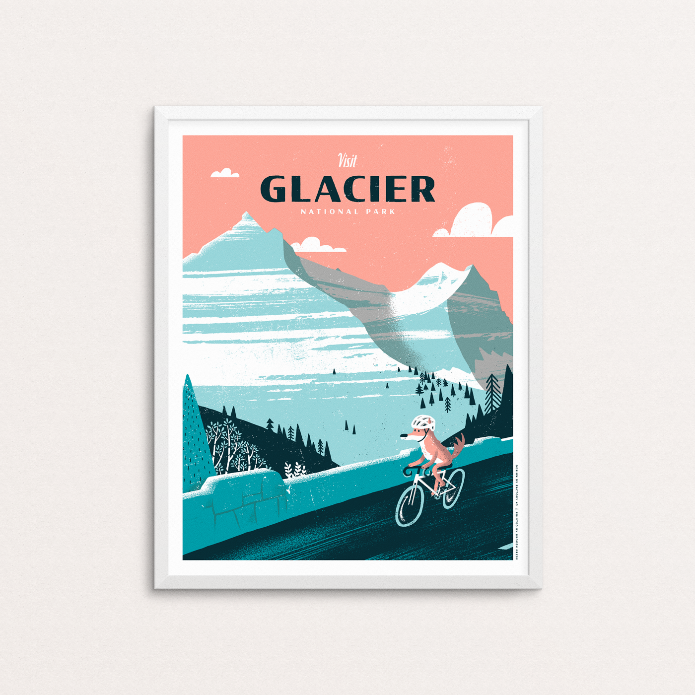 A wolverine takes a scenic bike ride in Glacier National Park in Montana. Poster shown in white frame.