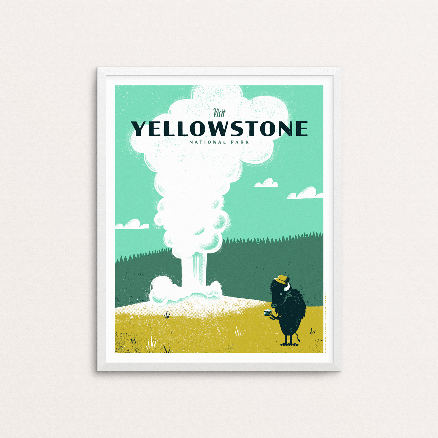 A bison snaps a photo of the geyser Old Faithful in action in Wyoming. Yellowstone National Park also encompasses Montana and Idaho. Poster is shown in a white frame.